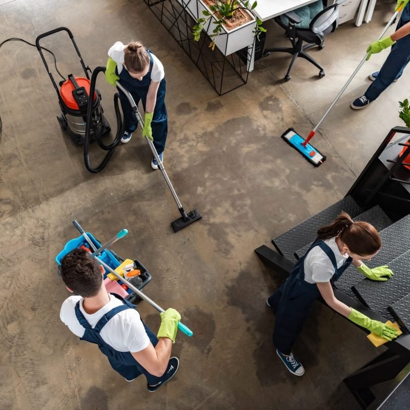 top-view-of-cleaning-company-team-cleaning-modern-office.jpg Upholstery Cleaning Services in Dubai
